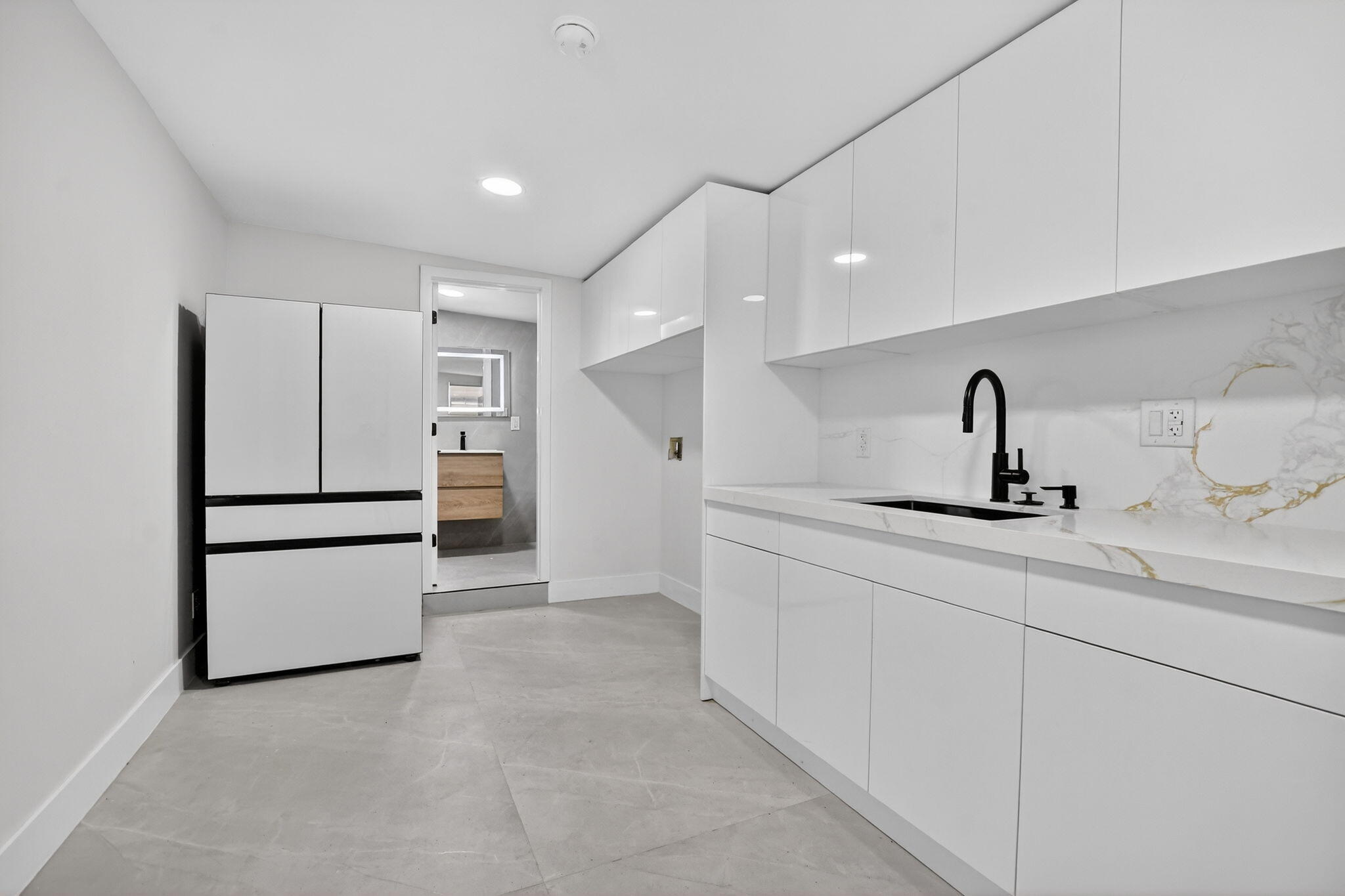 7134 San Sebastian Drive Boca Raton, FL 33433 - Photo 51 of 73 a kitchen with stainless steel appliances a refrigerator and a sink
