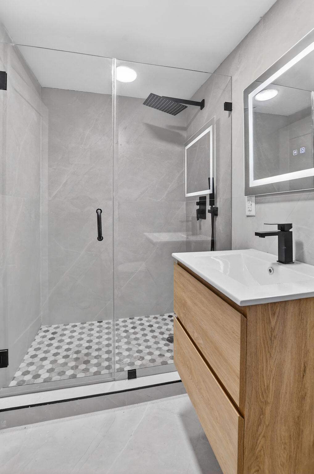 7134 San Sebastian Drive Boca Raton, FL 33433 - Photo 54 of 73 a bathroom with a sink a toilet a mirror and shower