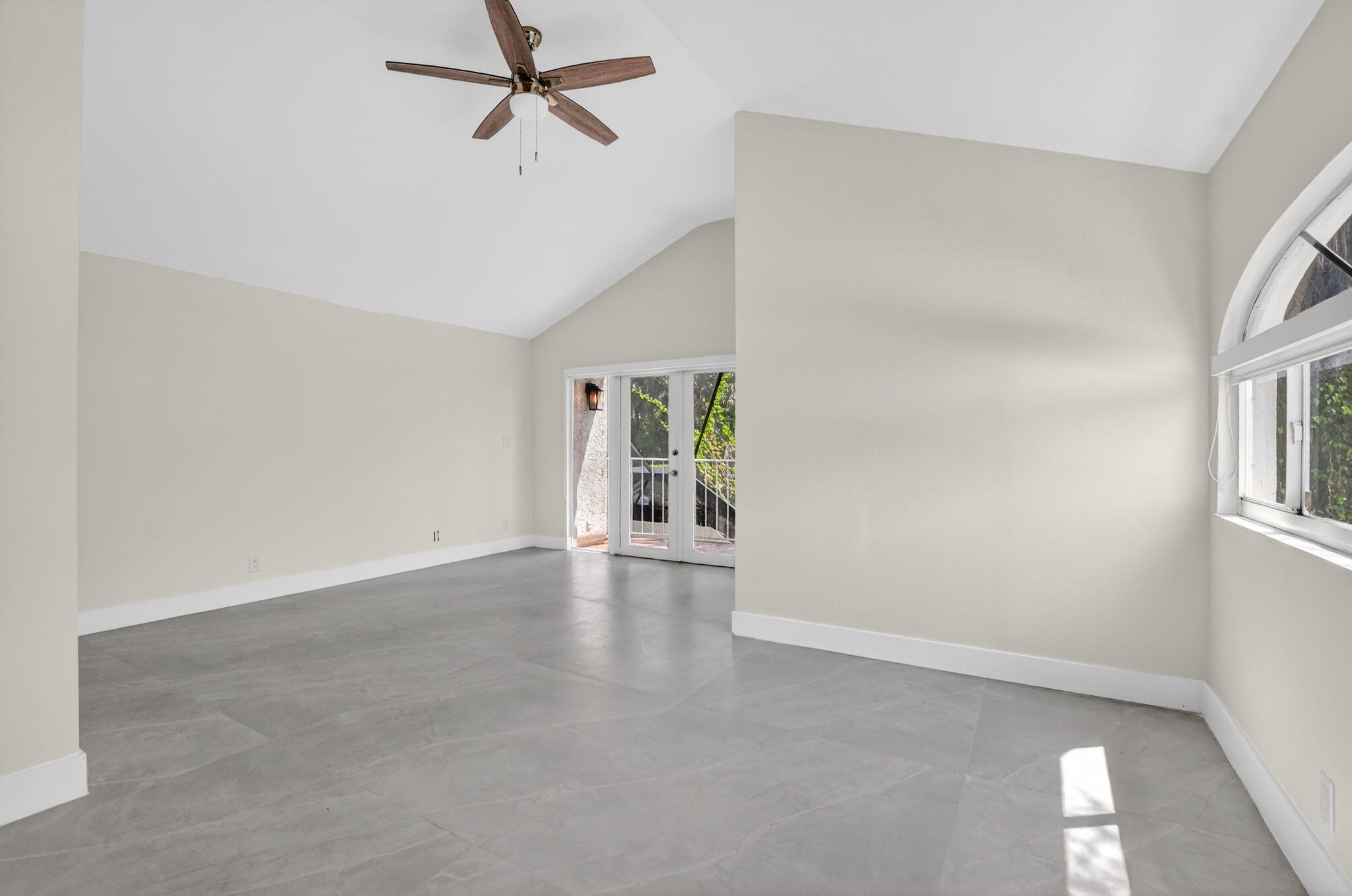 7134 San Sebastian Drive Boca Raton, FL 33433 - Photo 58 of 73 an empty room with windows and entrance