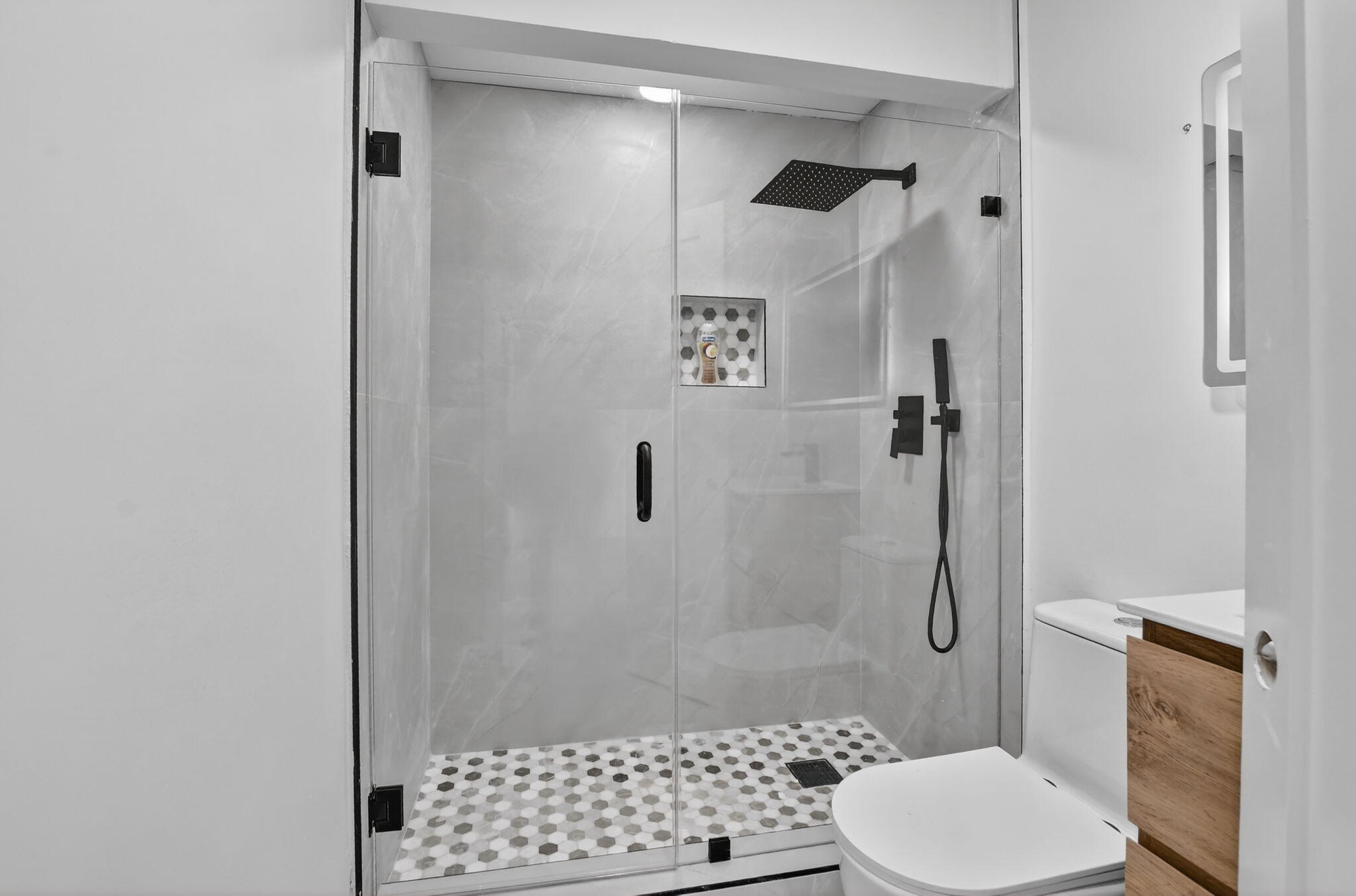 7134 San Sebastian Drive Boca Raton, FL 33433 - Photo 60 of 73 a bathroom with a shower toilet and sink