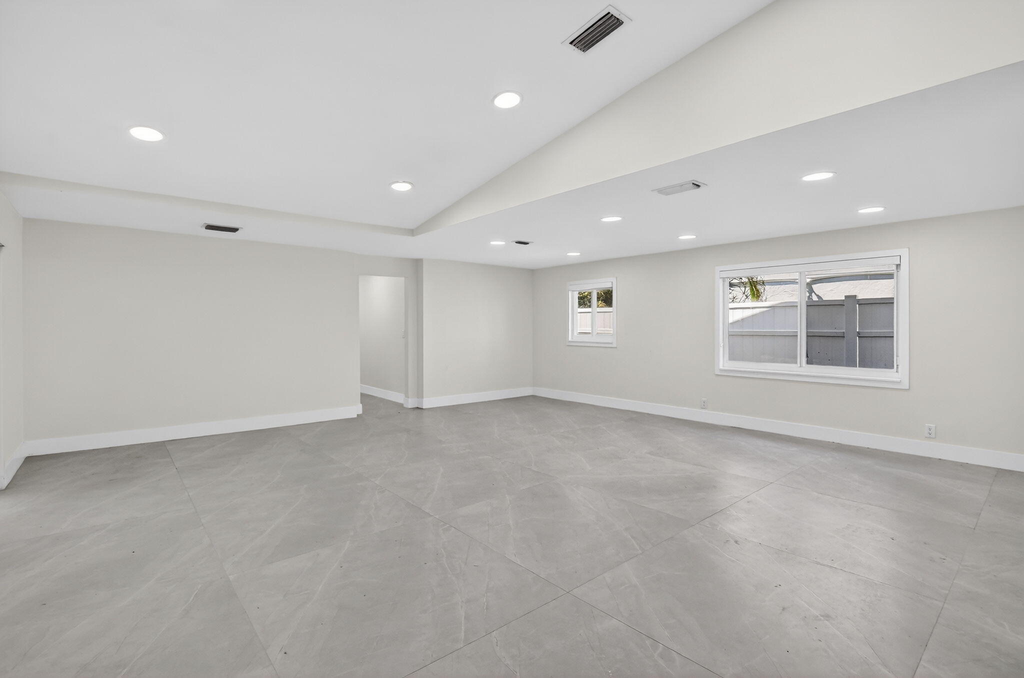 7134 San Sebastian Drive Boca Raton, FL 33433 - Photo 6 of 73 an empty room with windows