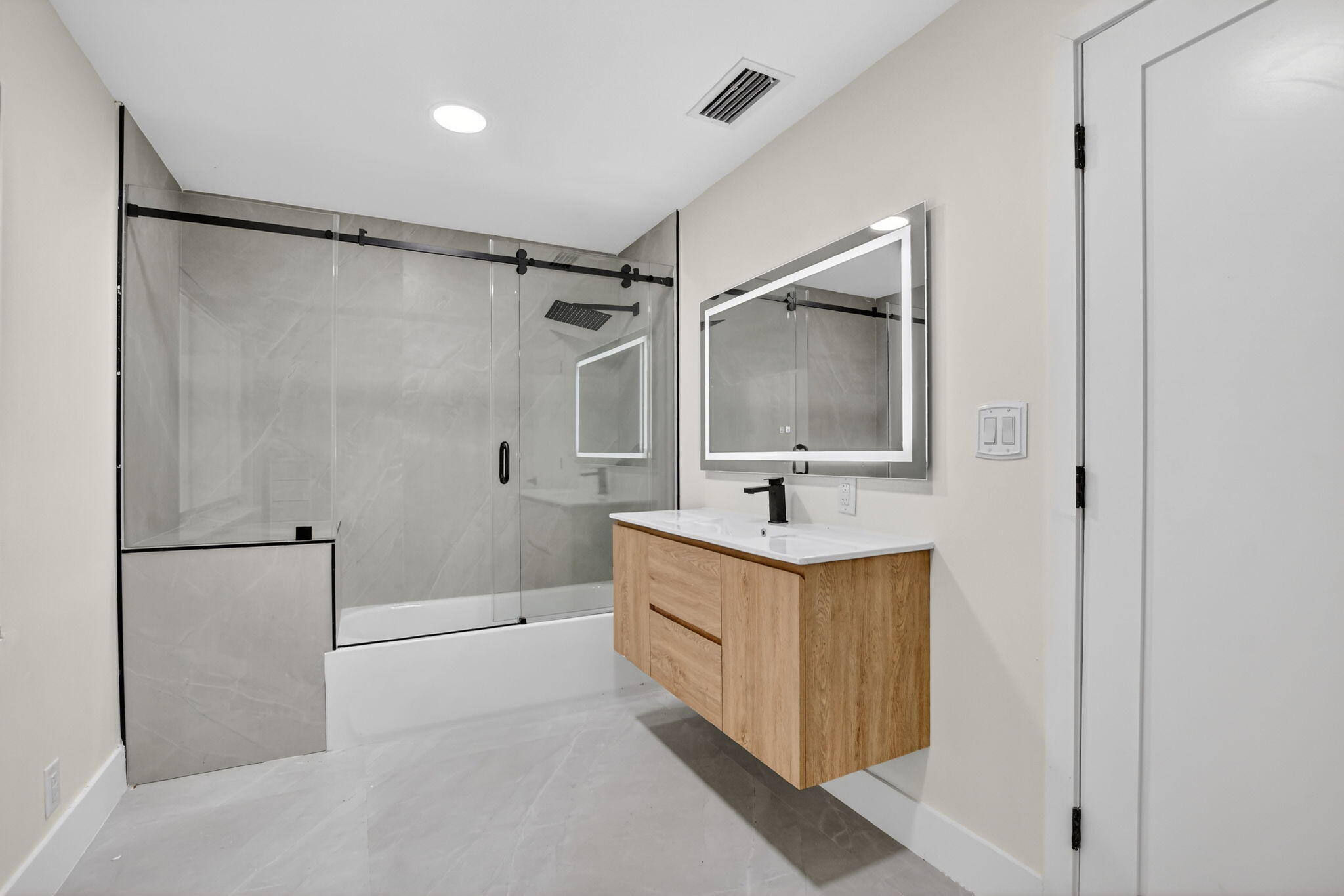 7134 San Sebastian Drive Boca Raton, FL 33433 - Photo 63 of 73 a bathroom with a shower sink and mirror