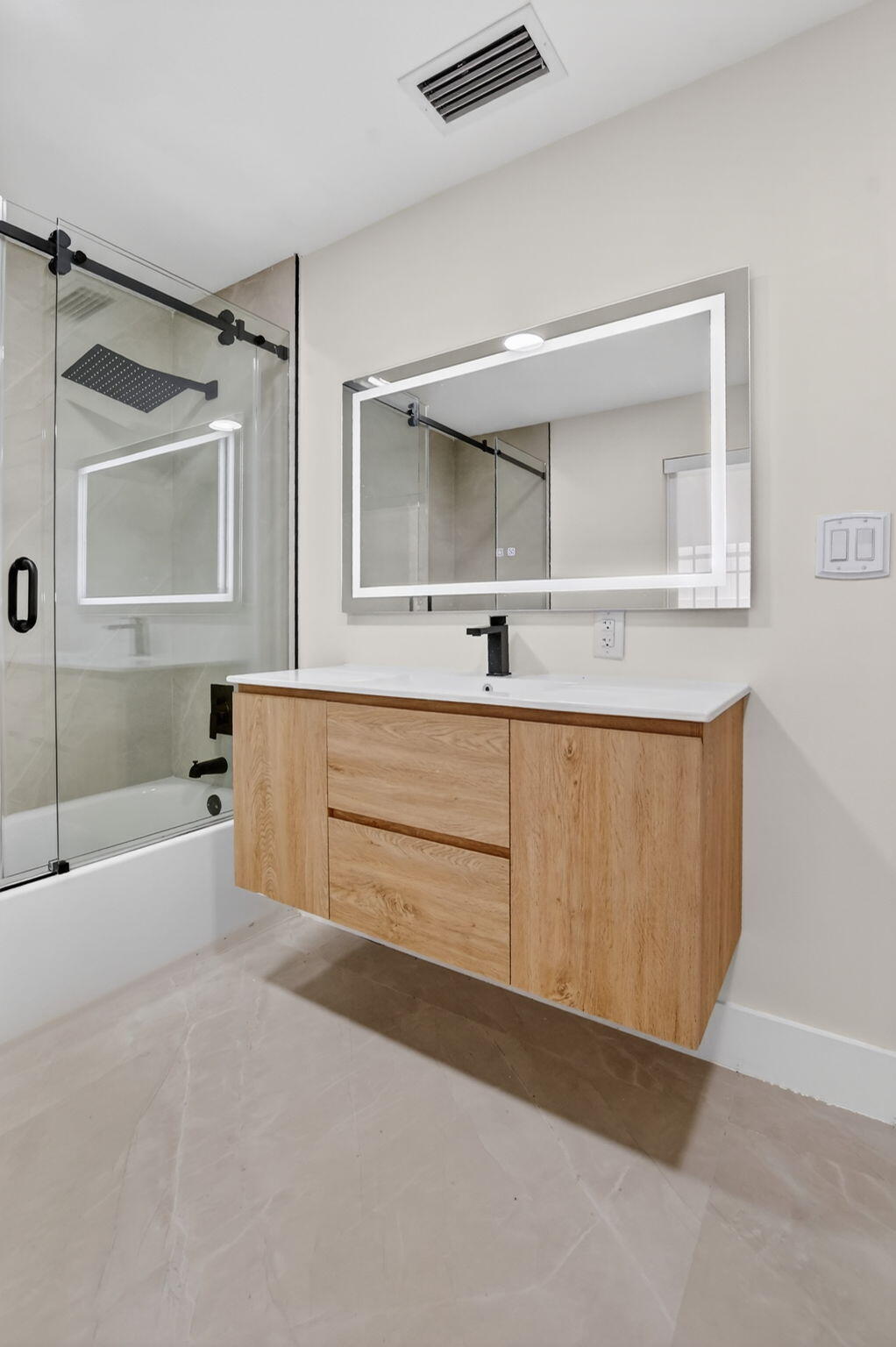 7134 San Sebastian Drive Boca Raton, FL 33433 - Photo 65 of 73 a bathroom with a tub a sink and mirror