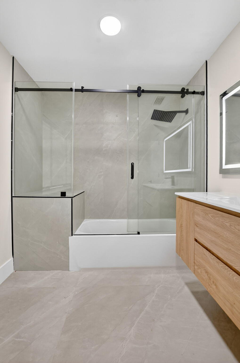 7134 San Sebastian Drive Boca Raton, FL 33433 - Photo 66 of 73 a bathroom with a tub a mirror and a shower