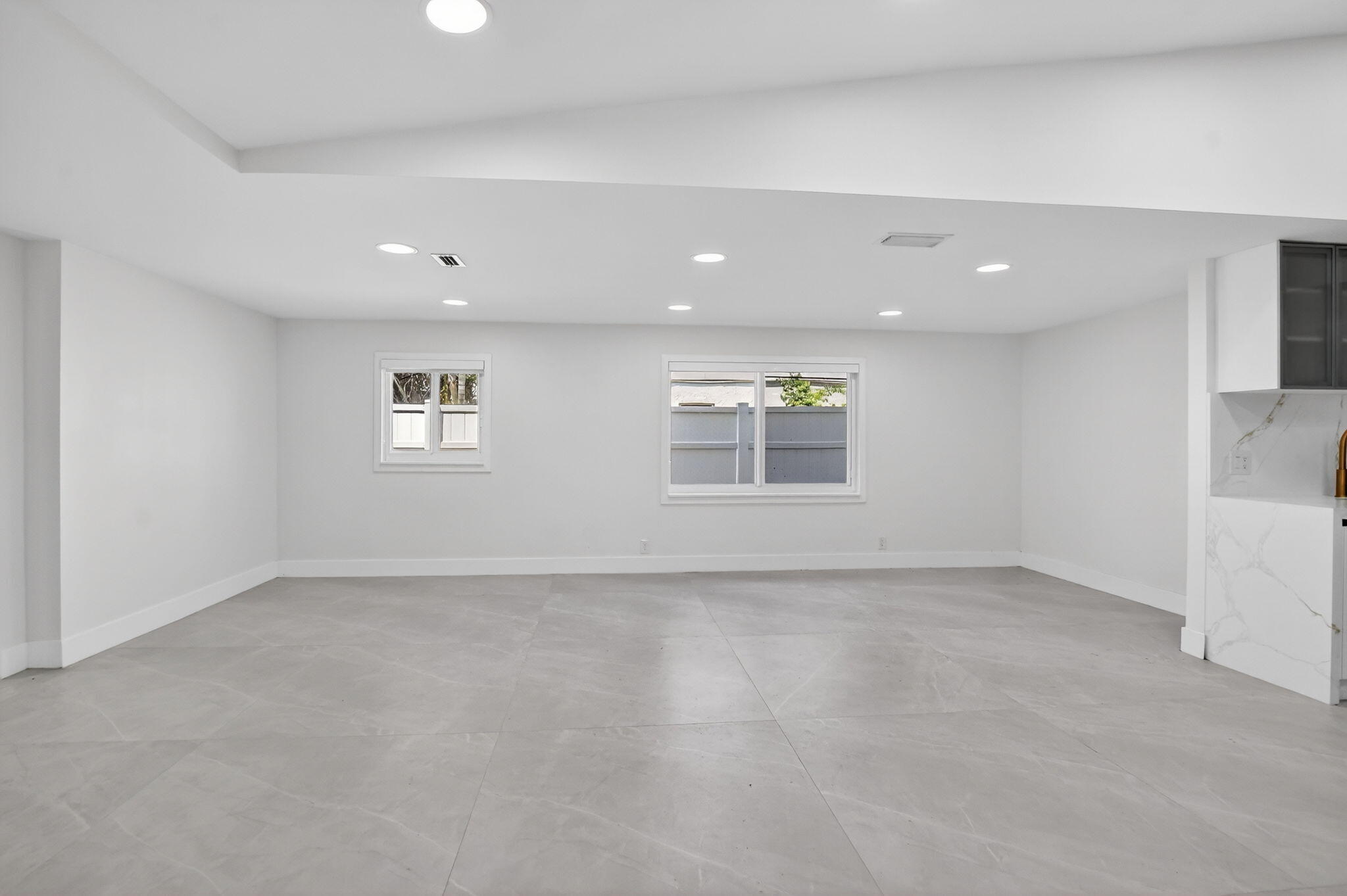 7134 San Sebastian Drive Boca Raton, FL 33433 - Photo 7 of 73 an empty room with windows