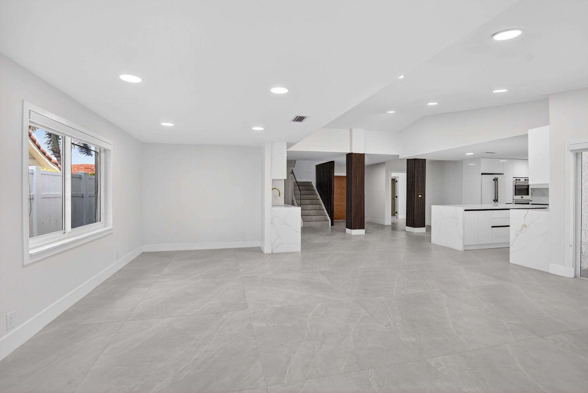 7134 San Sebastian Drive Boca Raton, FL 33433 - Photo 9 of 73 a view of an empty room with a window