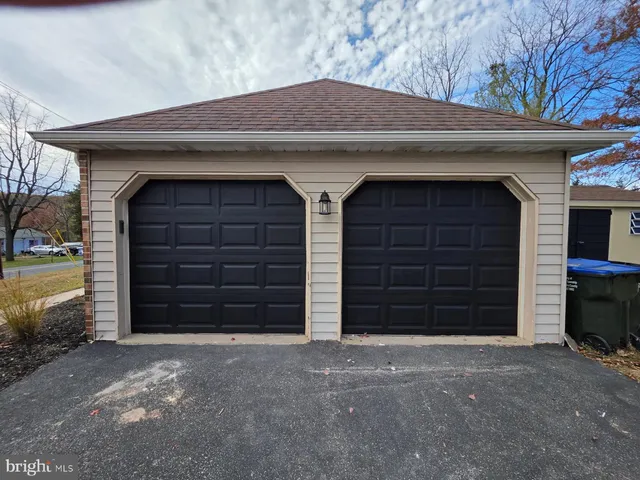 a view of front door and a garage