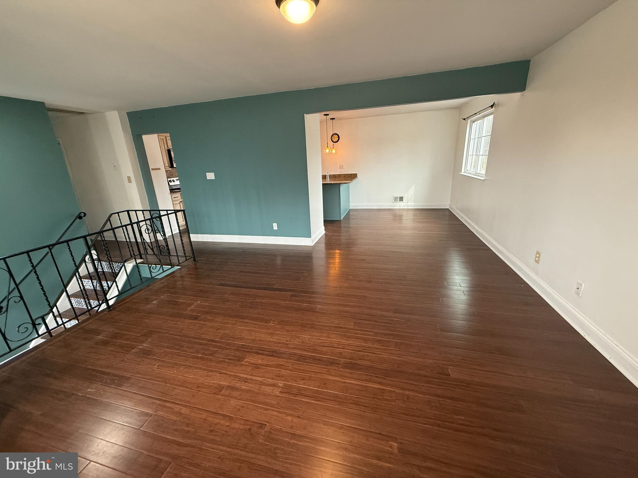 892 Estates Boulevard Hamilton, NJ 08690 - Photo 6 of 10 a view of an empty room with wooden floor