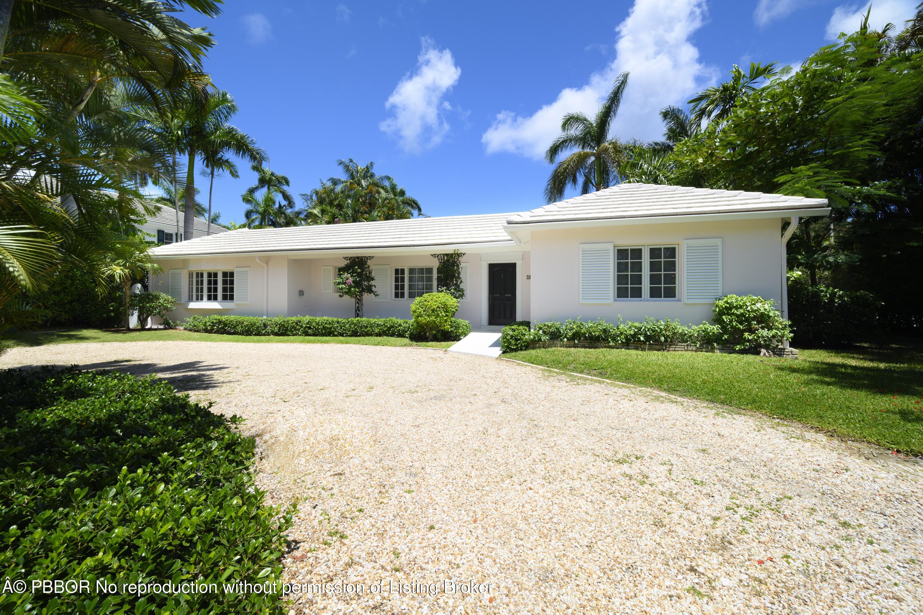 201 Pendleton Avenue Palm Beach, FL 33480 - Photo 16 of 22 a front view of a house with garden