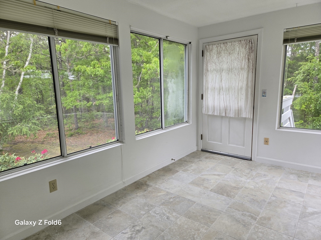 222 Buck Island Road, Unit 45 Yarmouth, MA 02673 - Photo 10 of 23 a view of an empty room with window