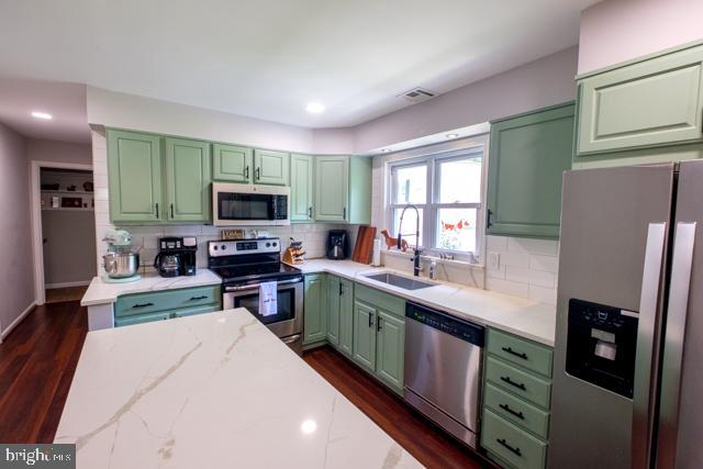 31 Bordentown Chesterfield Road Chesterfield, NJ 08515 - Photo 15 of 55 a kitchen with stainless steel appliances a stove top oven a sink dishwasher a refrigerator and a refrigerator