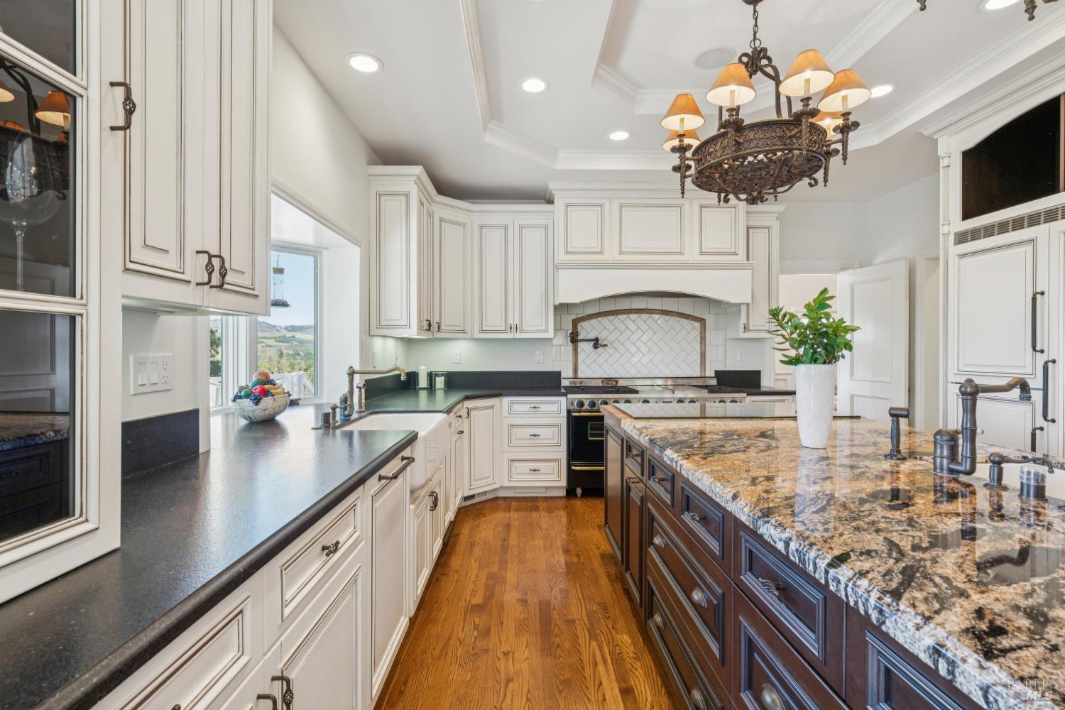 3265 Soda Canyon Road Napa, CA 94558 - Photo 15 of 36 a large kitchen with stainless steel appliances granite countertop a lot of counter space and wooden floors