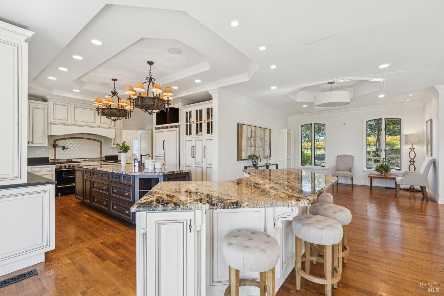 3265 Soda Canyon Road Napa, CA 94558 - Photo 17 of 36 a kitchen with stainless steel appliances kitchen island granite countertop a stove and cabinets