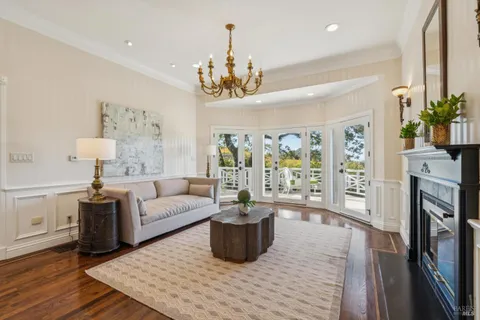 a living room with fireplace furniture and a flat screen tv