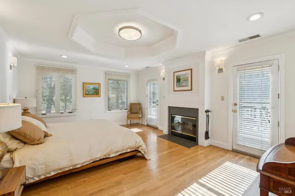 a bedroom with a bed and a fireplace