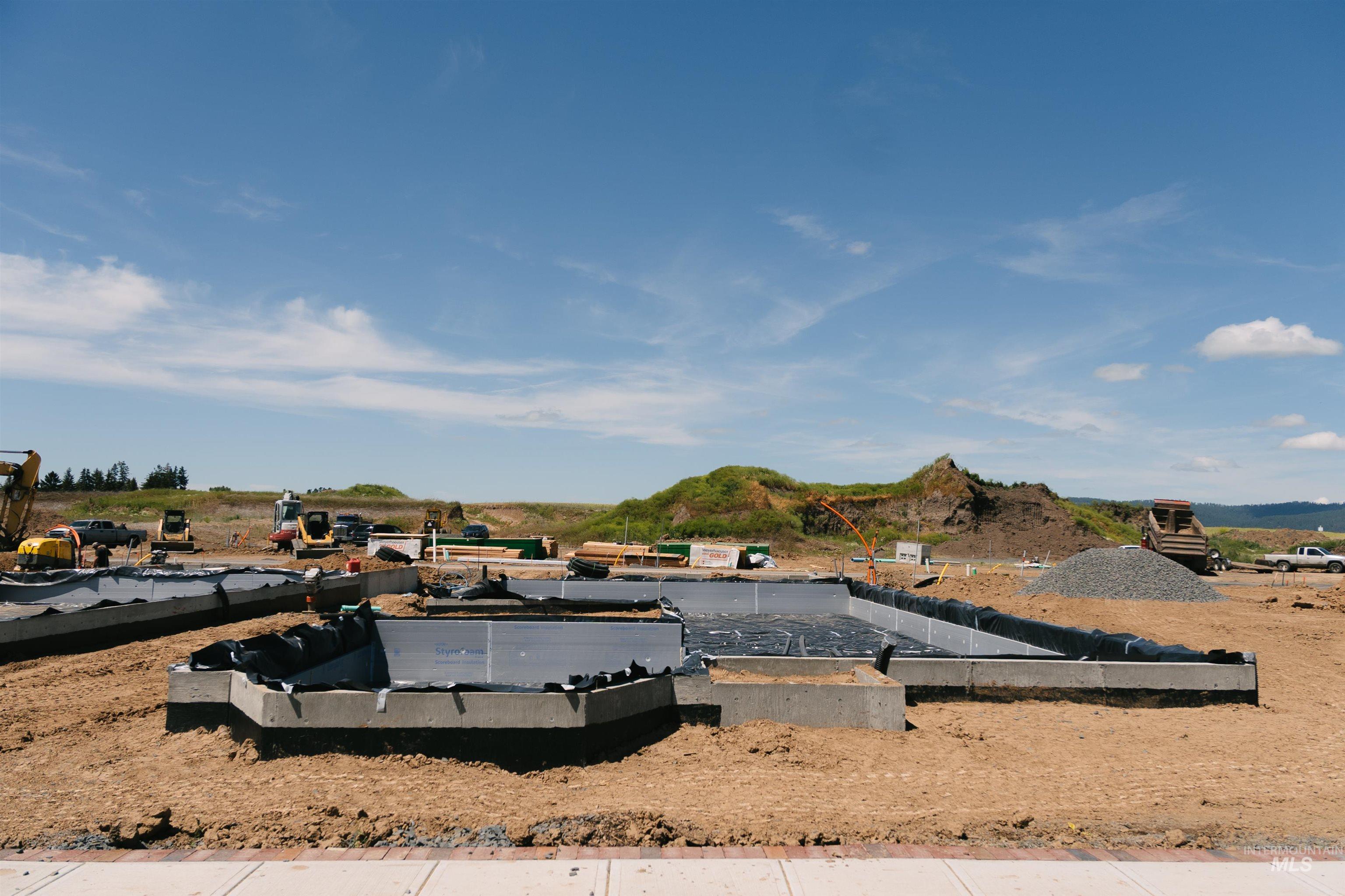 1463 Cottage Lane Moscow, ID 83843 - Photo 6 of 23 Concrete foundation with moisture barrier installed on a level lot, surrounded by open terrain