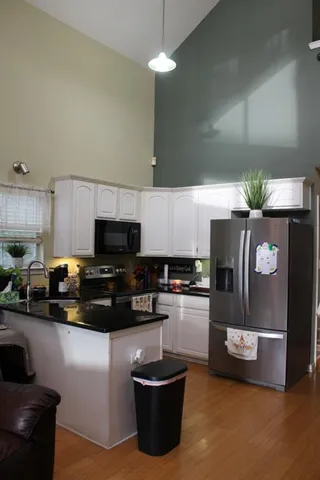 a kitchen with a sink and a stove top oven