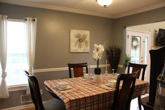 a view of a dining room with furniture