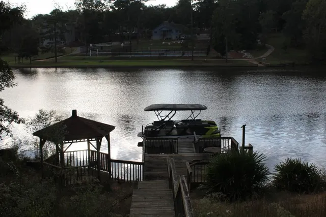 a view of a chairs and table in the wooden floor