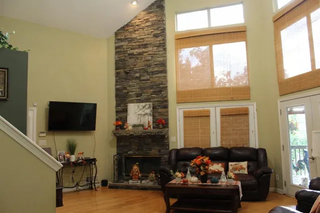 a living room with furniture fireplace and a flat screen tv