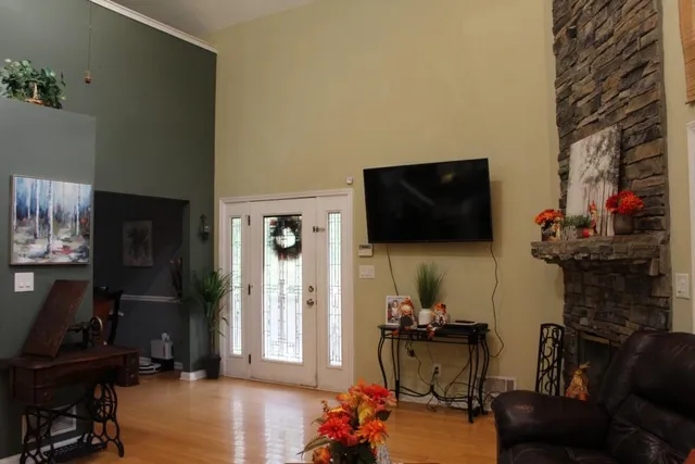 a living room with furniture and a flat screen tv