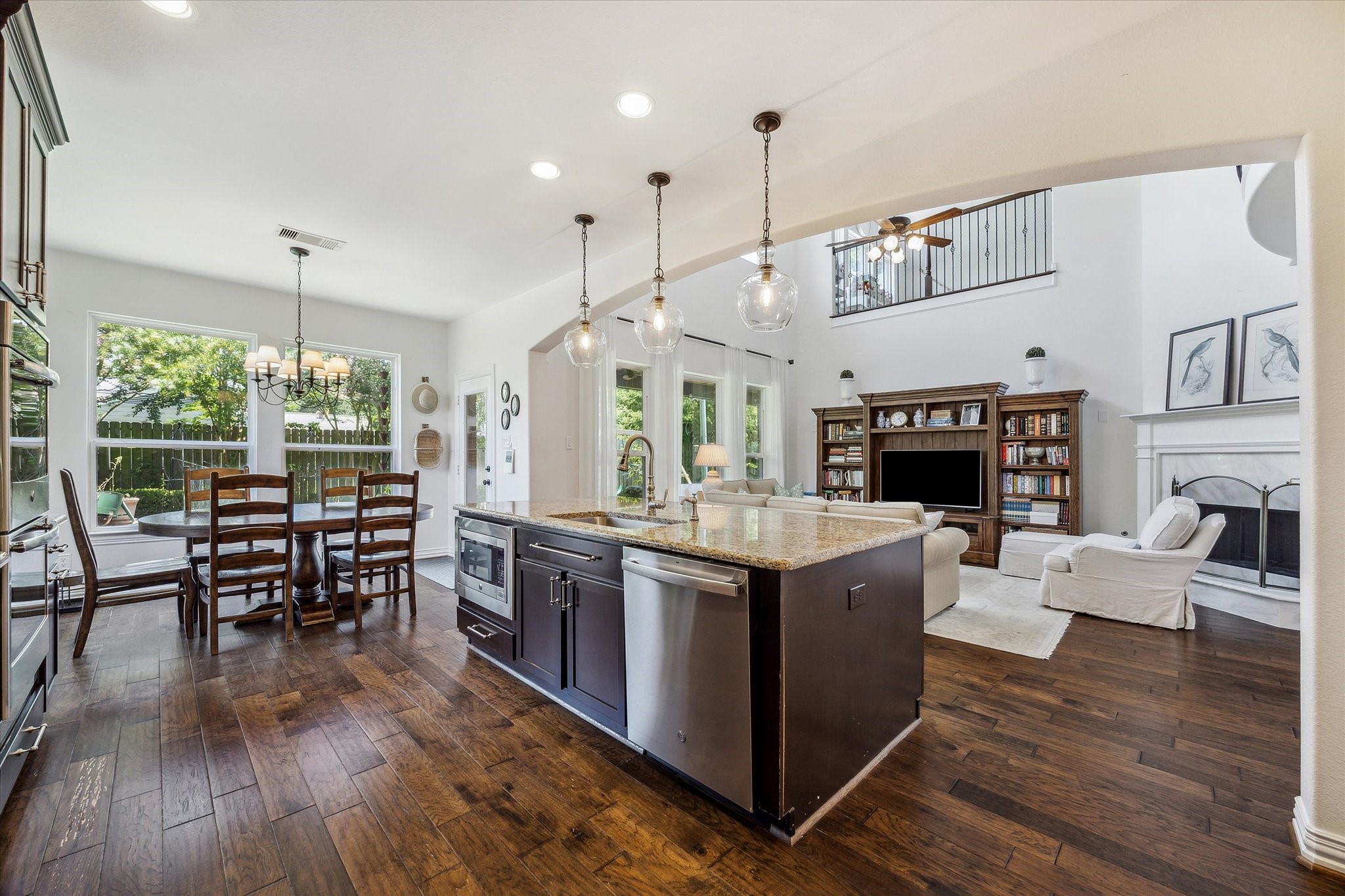 1515 Thornton Road Houston, TX 77018 - Photo 14 of 38 Adjacent to the living room, the home features an open-concept gourmet kitchen outfitted with high-end appliances, a large central island and a breakfast area with convenient access to the backyard and patio.