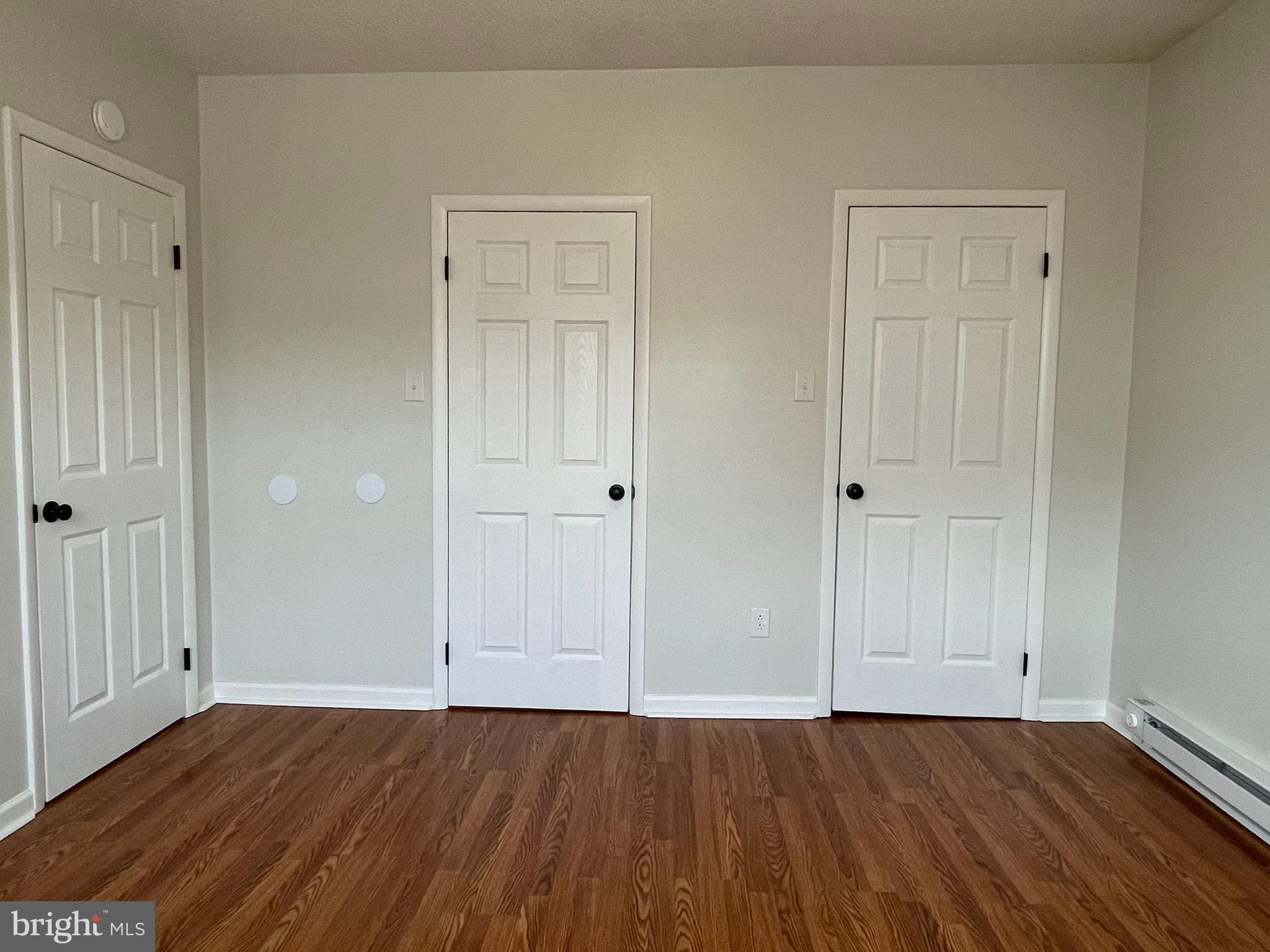 317 Bridge Street, Unit 2 Phoenixville, PA 19460 - Photo 11 of 12 a view of an empty room with wooden floor