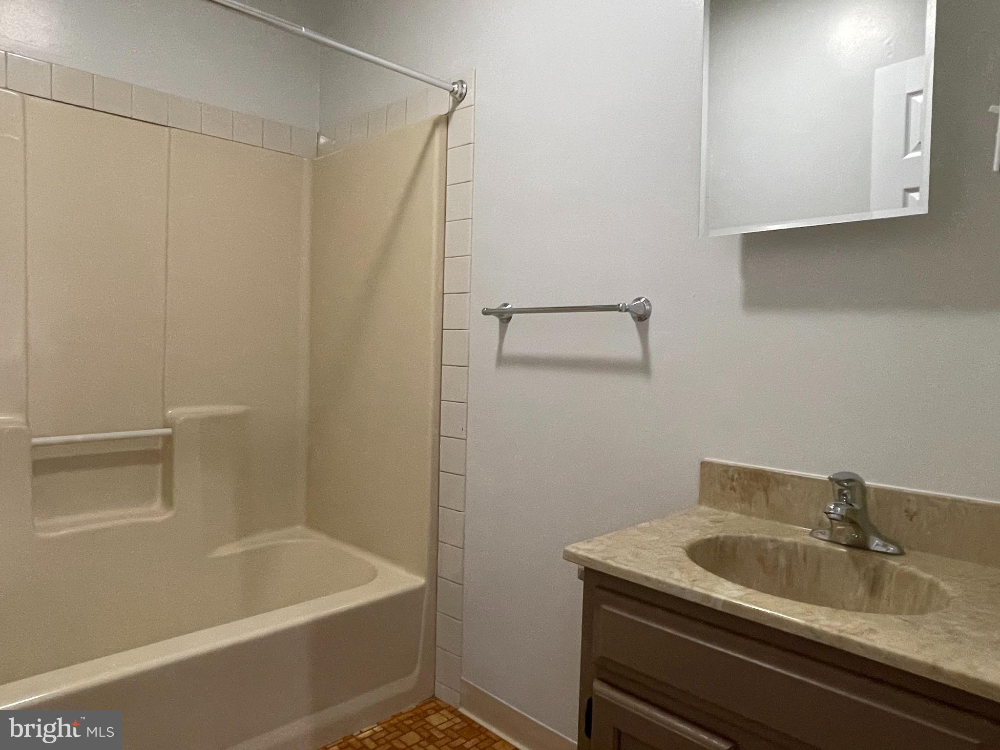 317 Bridge Street, Unit 2 Phoenixville, PA 19460 - Photo 9 of 12 a bathroom with a sink and a bathtub