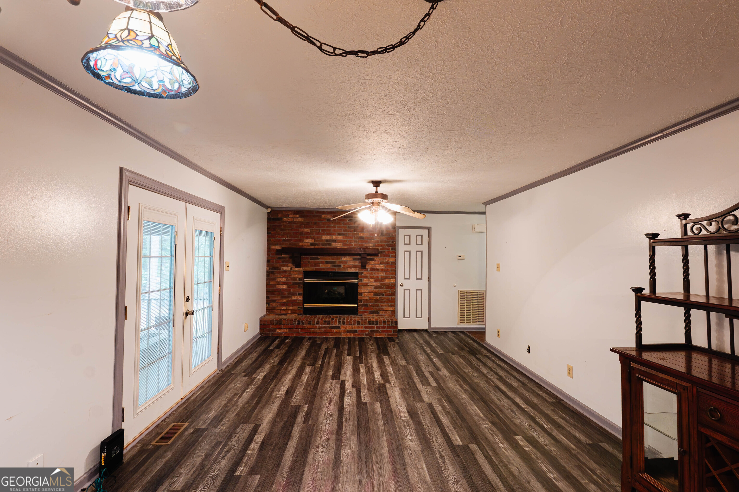 139 Cords Bridge Road Northeast Milledgeville, GA 31061 - Photo 3 of 35 wooden floor in an empty room with a window