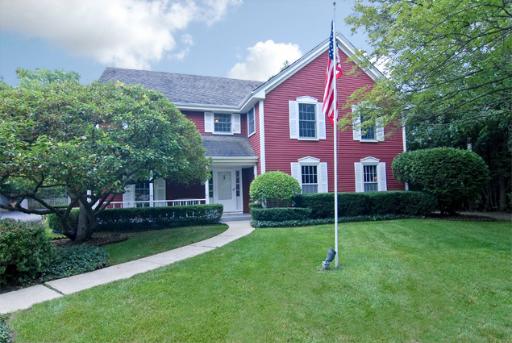 a view of a brick house with a yard