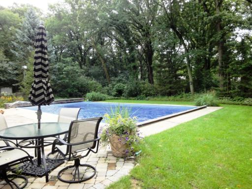 1309 Inverlieth Road Lake Forest, IL 60045 - Photo 12 of 13 a view of a swimming pool with chair and table