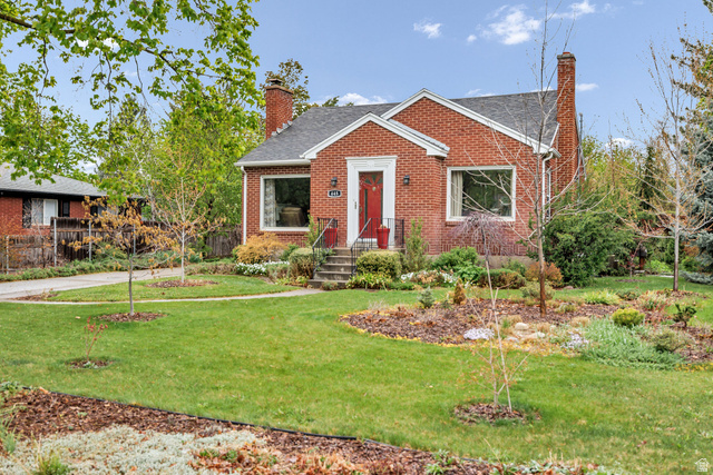 445 East 500 South River Heights, UT 84321 - Photo 1 of 1 View of front of home with a chimney, roof with shingles, and brick siding