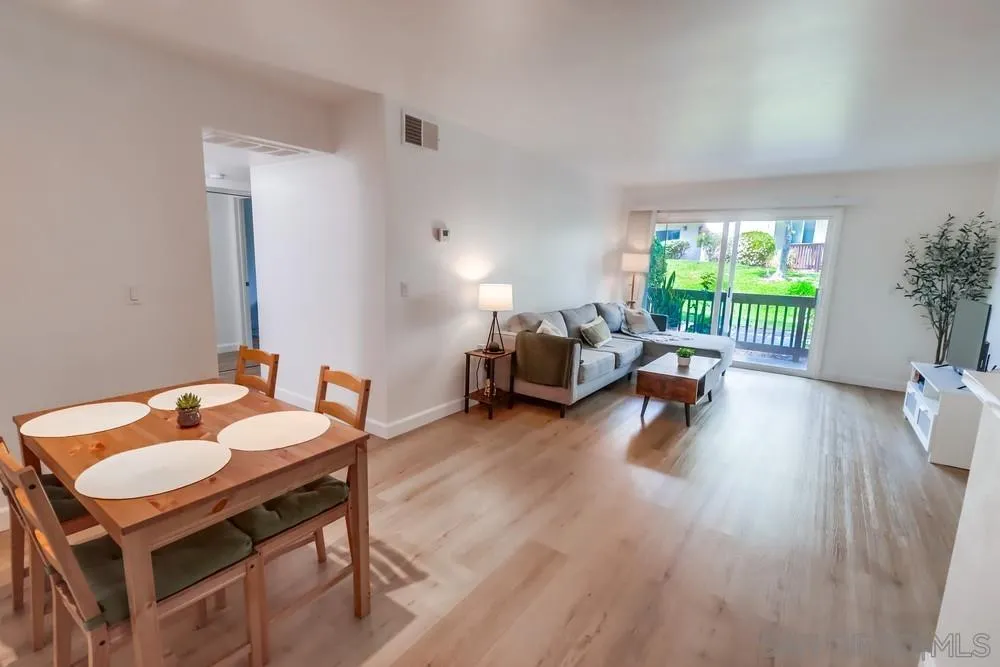 6191 Rancho Mission Road, Unit 105 San Diego, CA 92108 - Photo 2 of 31 a living room with furniture and a wooden floor