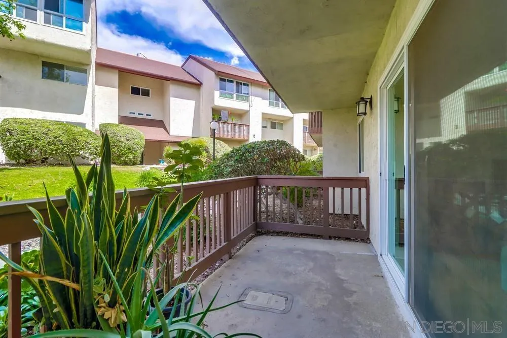 6191 Rancho Mission Road, Unit 105 San Diego, CA 92108 - Photo 21 of 31 a view of a house with balcony and wooden floor