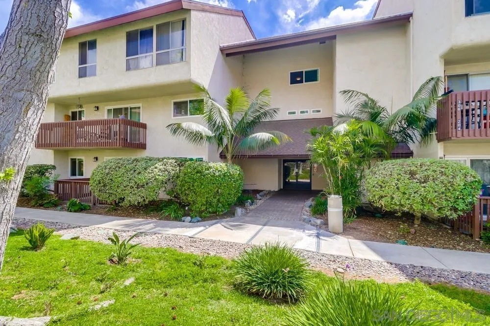 6191 Rancho Mission Road, Unit 105 San Diego, CA 92108 - Photo 23 of 31 a front view of a house with garden