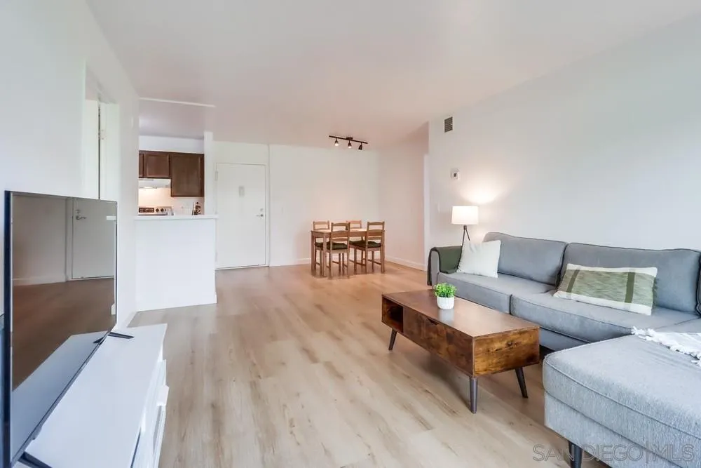 6191 Rancho Mission Road, Unit 105 San Diego, CA 92108 - Photo 4 of 31 a living room with furniture and a wooden floor