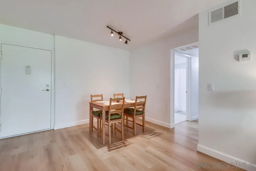 6191 Rancho Mission Road, Unit 105 San Diego, CA 92108 - Photo 6 of 31 a view of a dining room with furniture