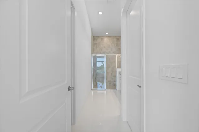 a bathroom with a granite countertop sink mirror and
