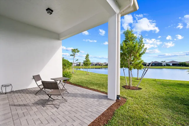 a view of a patio with a table and chairs
