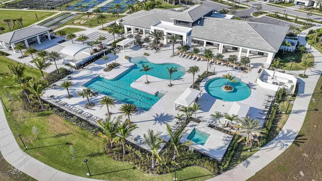 a view of a swimming pool with a lounge chair