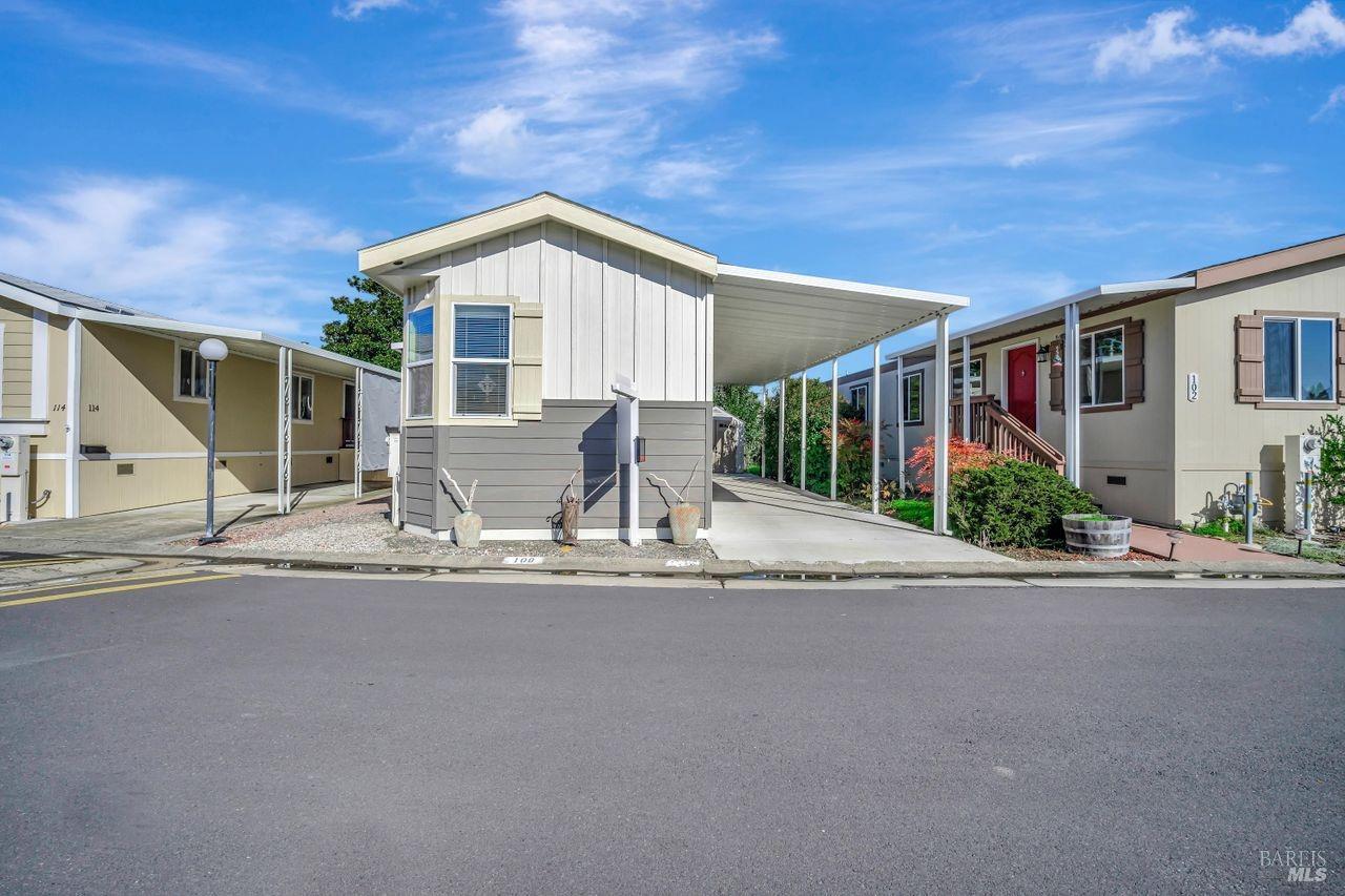 a view of a house with a sink and yard