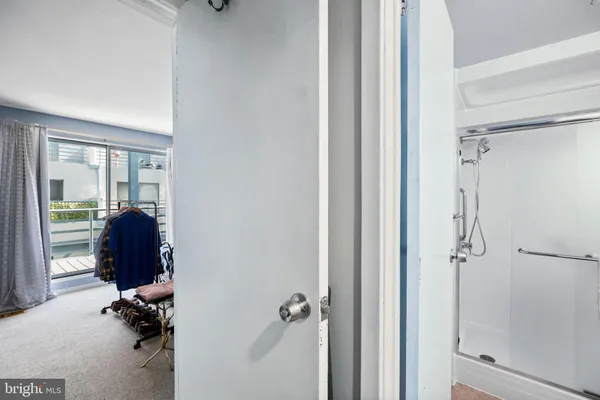 a bedroom with a bed and walk in closet