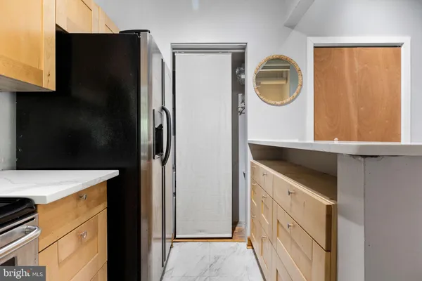a bathroom with a sink a mirror and a shower
