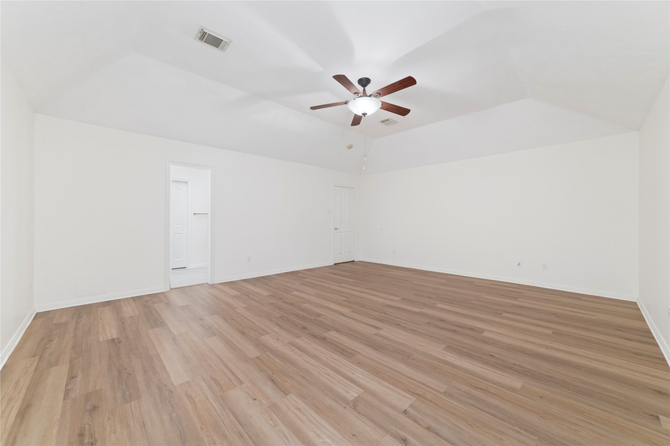 11108 Dawson Road Pearland, TX 77584 - Photo 14 of 43 a view of empty room with wooden floor