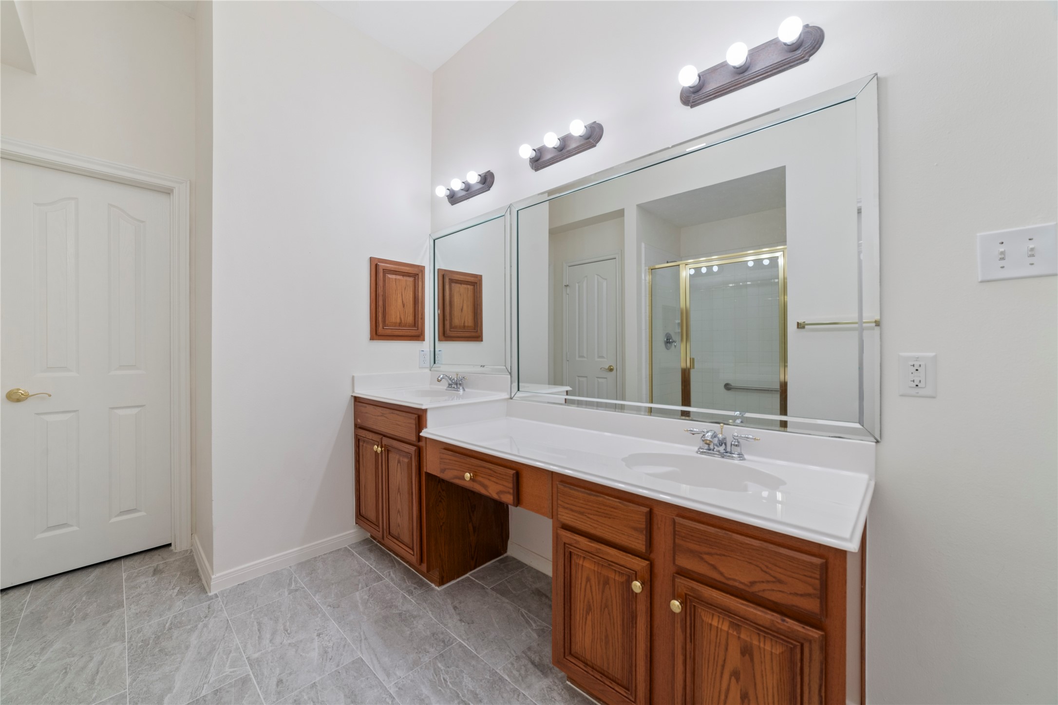 11108 Dawson Road Pearland, TX 77584 - Photo 16 of 43 a bathroom with a sink double vanity and a mirror