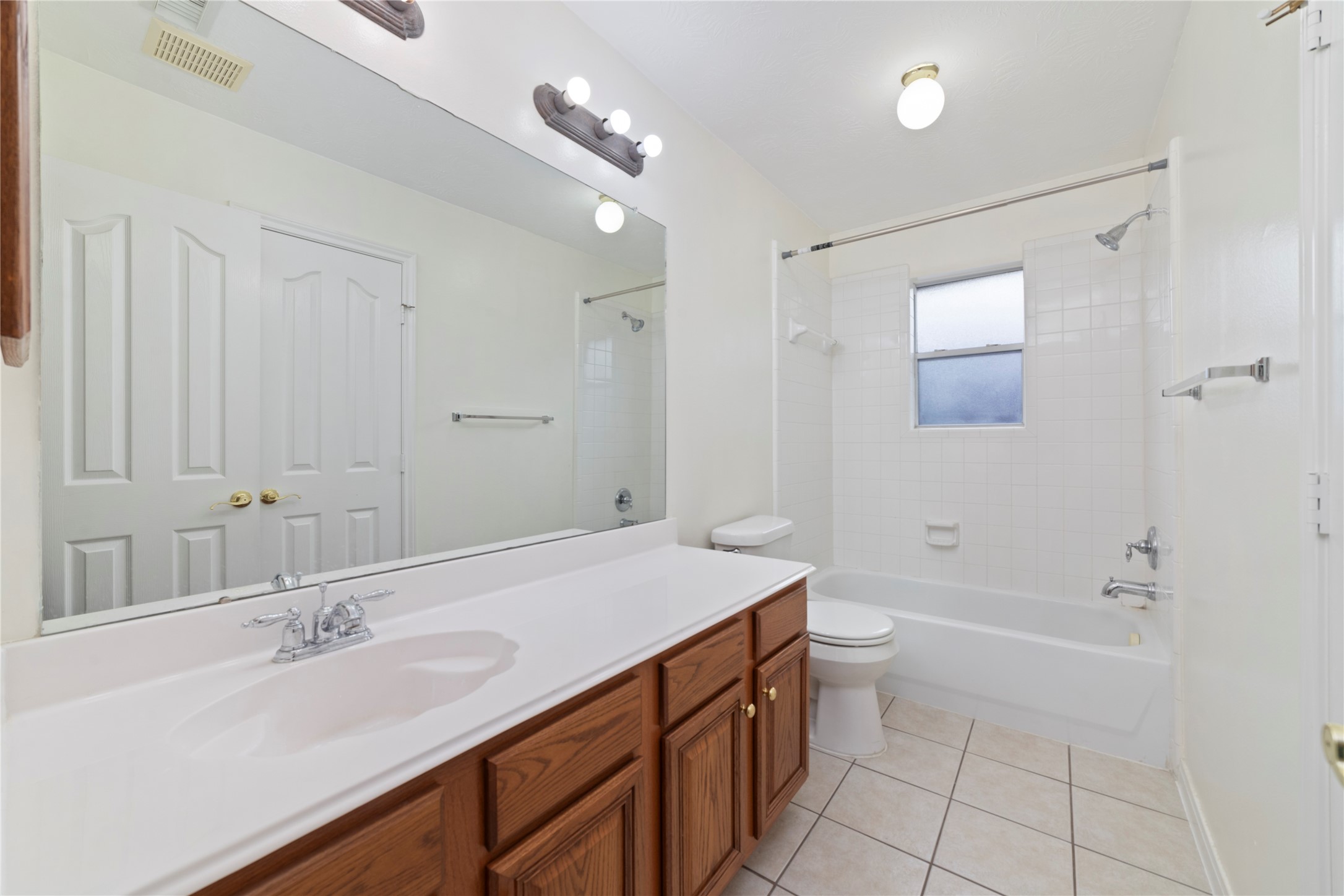 11108 Dawson Road Pearland, TX 77584 - Photo 21 of 43 a bathroom with a sink a toilet and shower