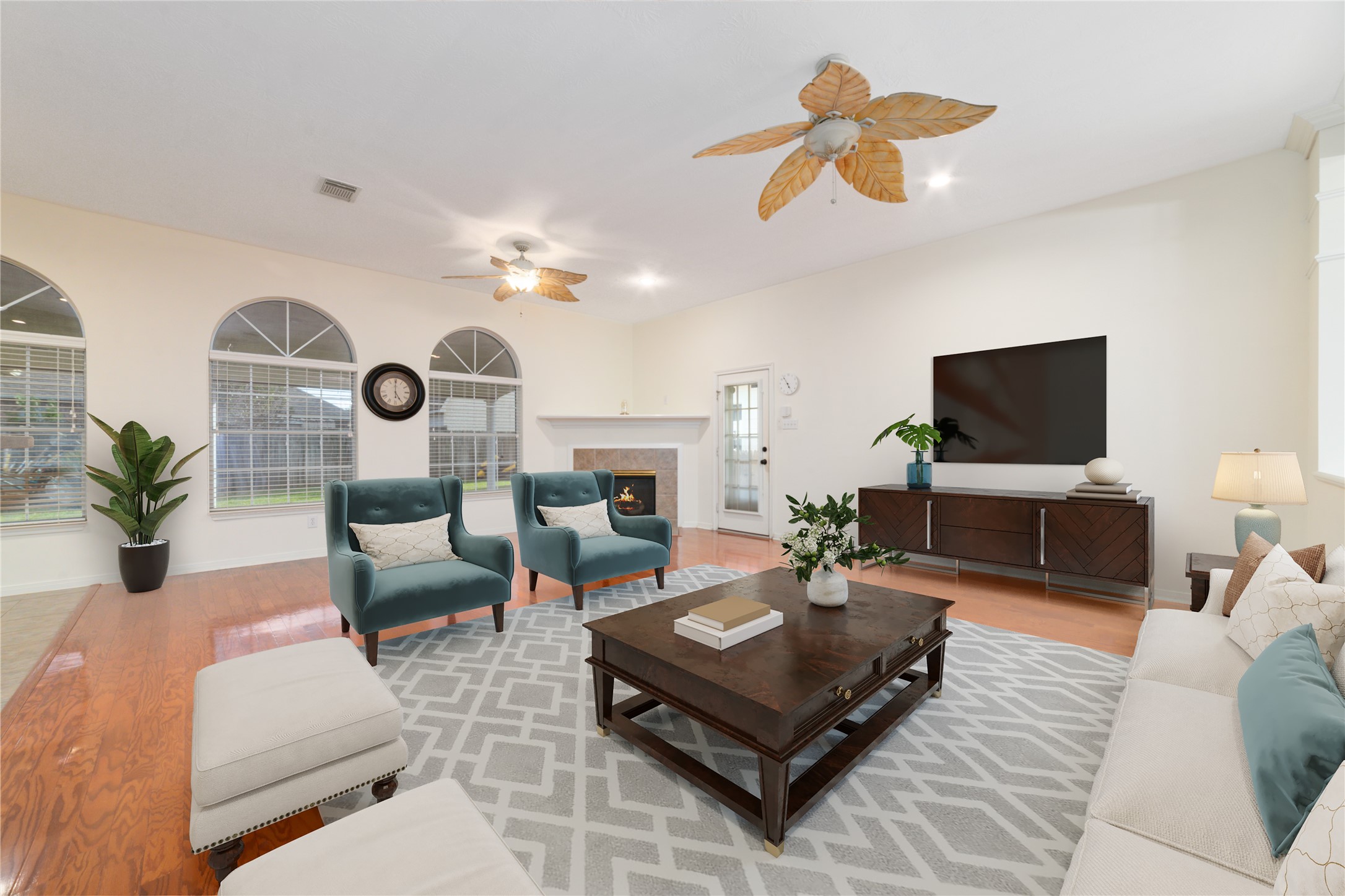 11108 Dawson Road Pearland, TX 77584 - Photo 24 of 43 a living room with furniture a flat screen tv and a chandelier
