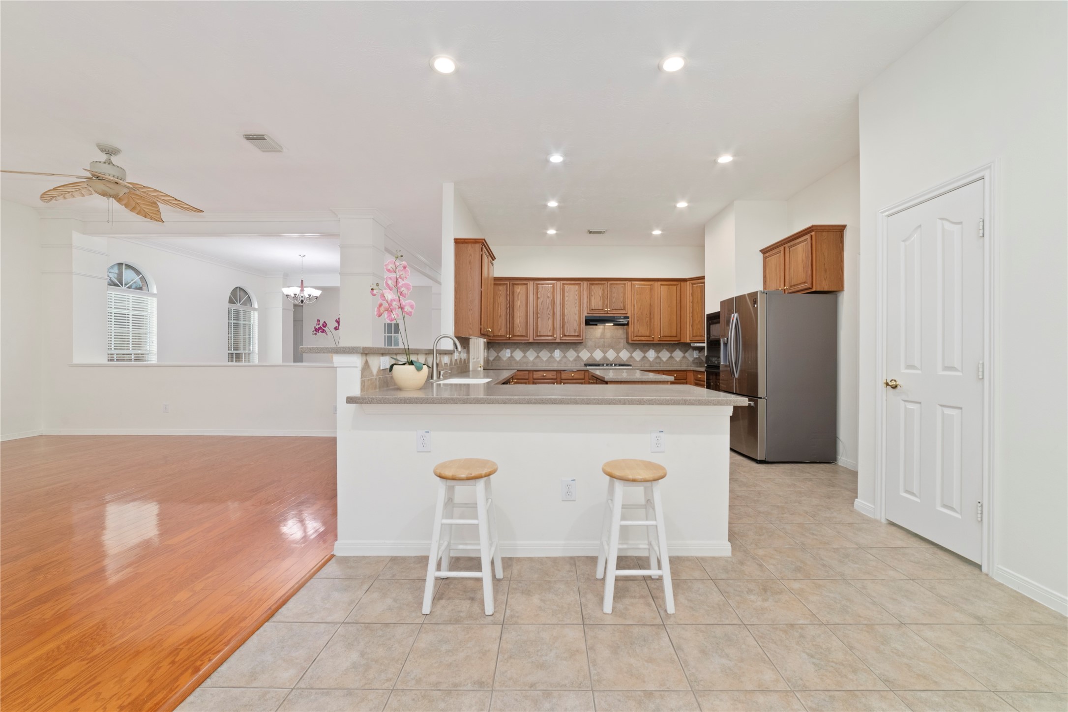 11108 Dawson Road Pearland, TX 77584 - Photo 28 of 43 a kitchen with stainless steel appliances granite countertop a sink and a refrigerator