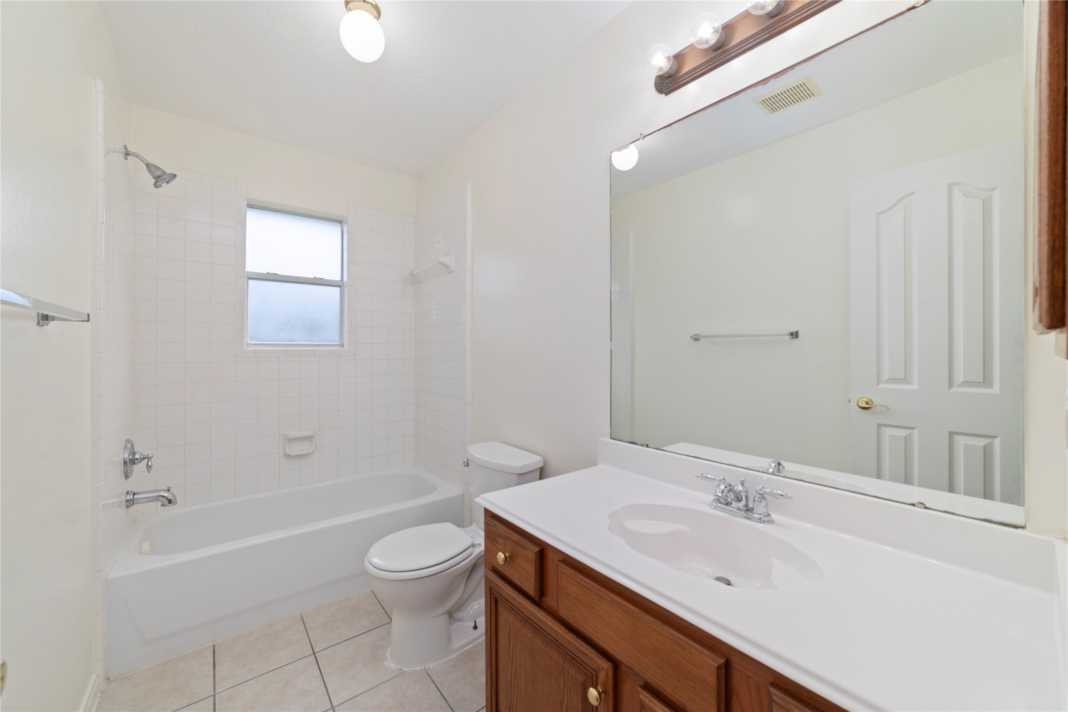 11108 Dawson Road Pearland, TX 77584 - Photo 37 of 43 a bathroom with a granite countertop sink a toilet and shower
