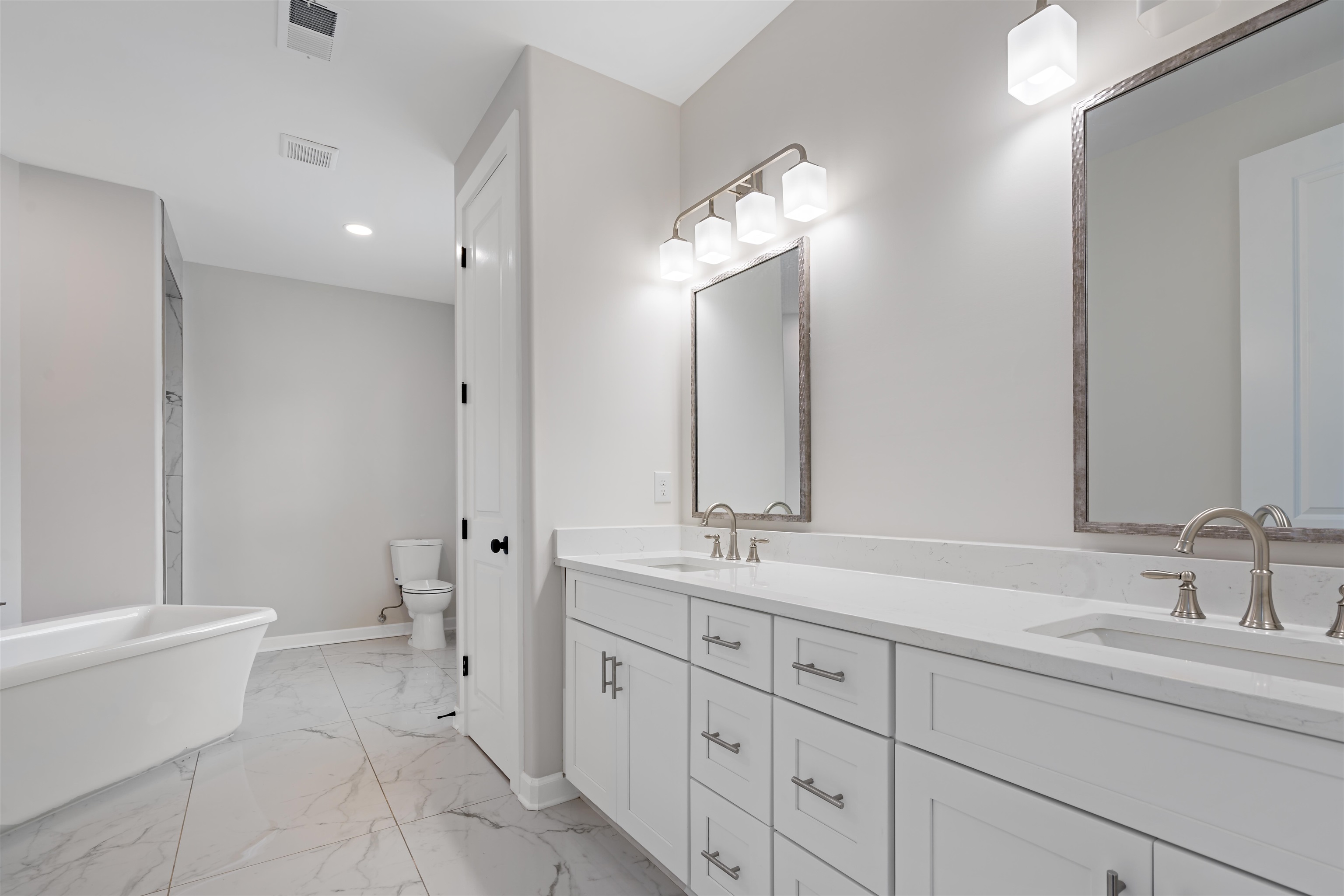 694 Brownlee Road Memphis, TN 38116 - Photo 9 of 15 Bathroom featuring dual vanity, toilet, tile patterned floors, and a bathing tub